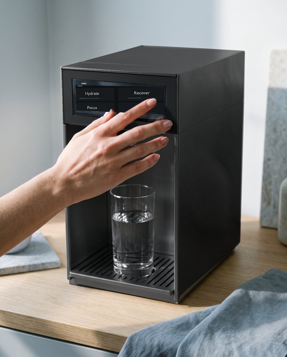 A hand using the machine touchscreen